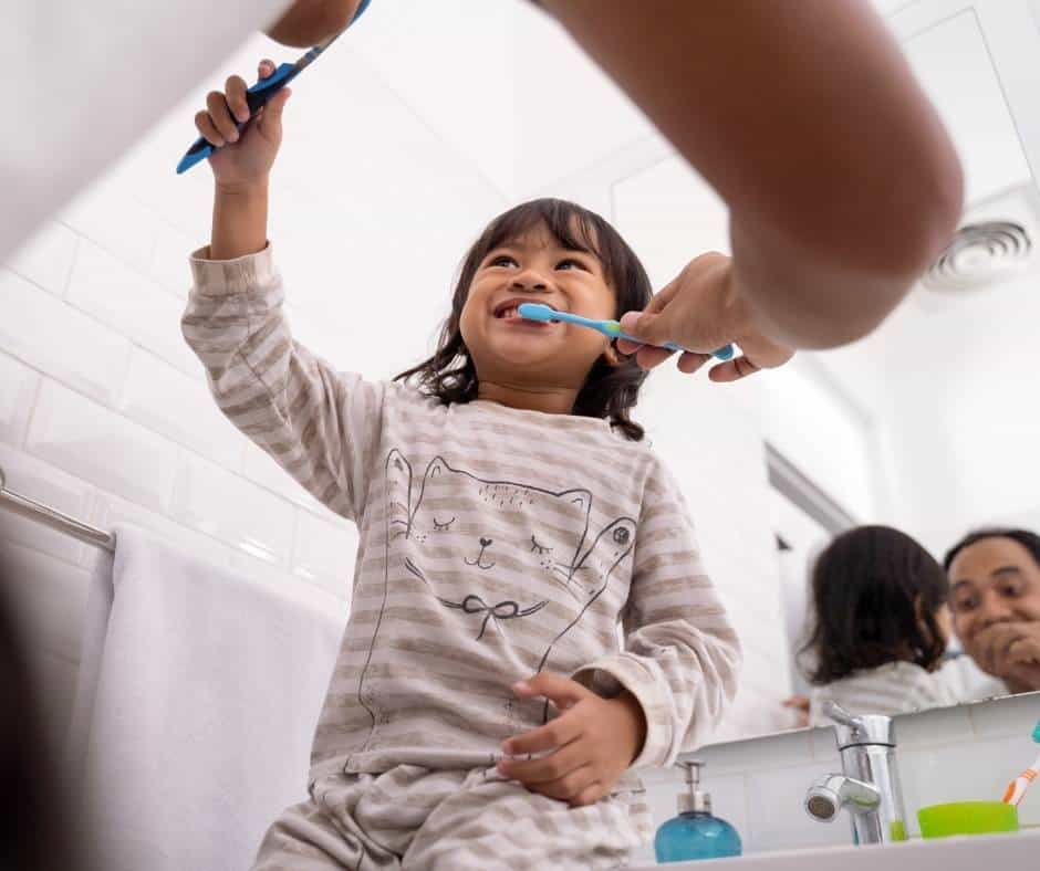 FatherDaughterBrushingEachOthersTeeth MillenniDad